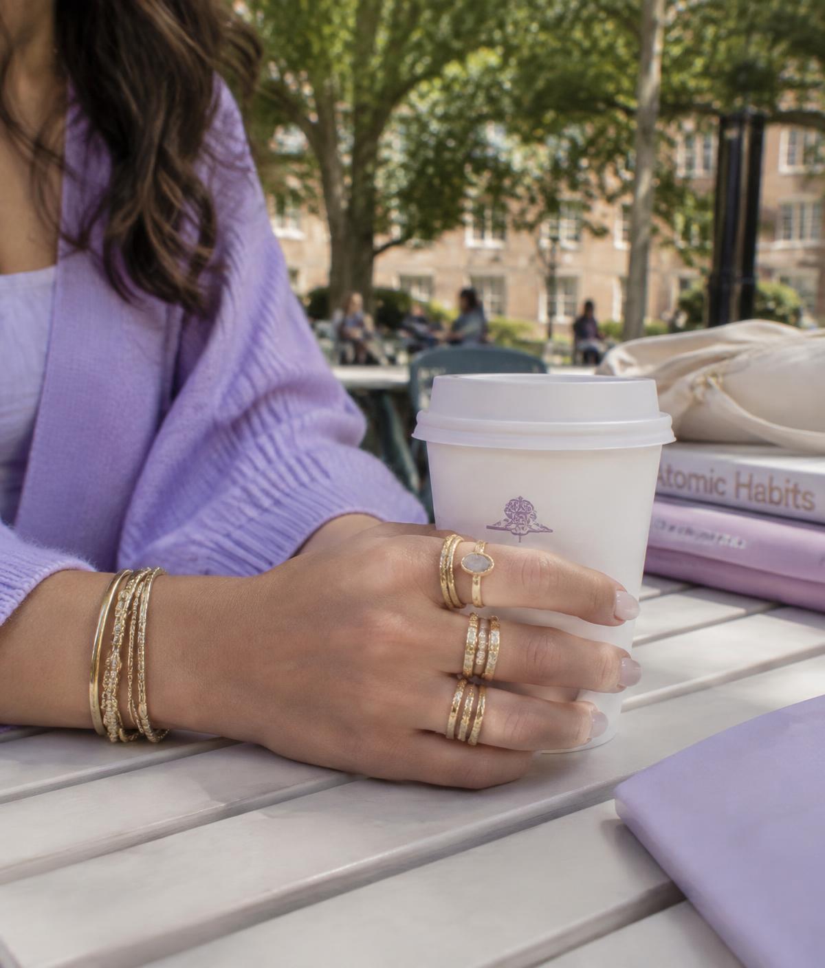 Stacked rings and bangles styled for a college day